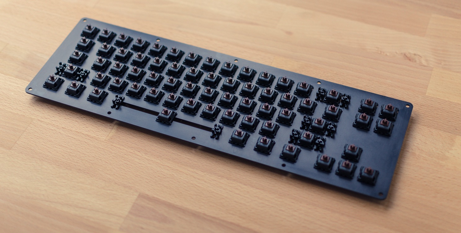Black anodized Aluminium mechanical keyboard with Cherry MX brown switches and Plate-mounted Stabilizers